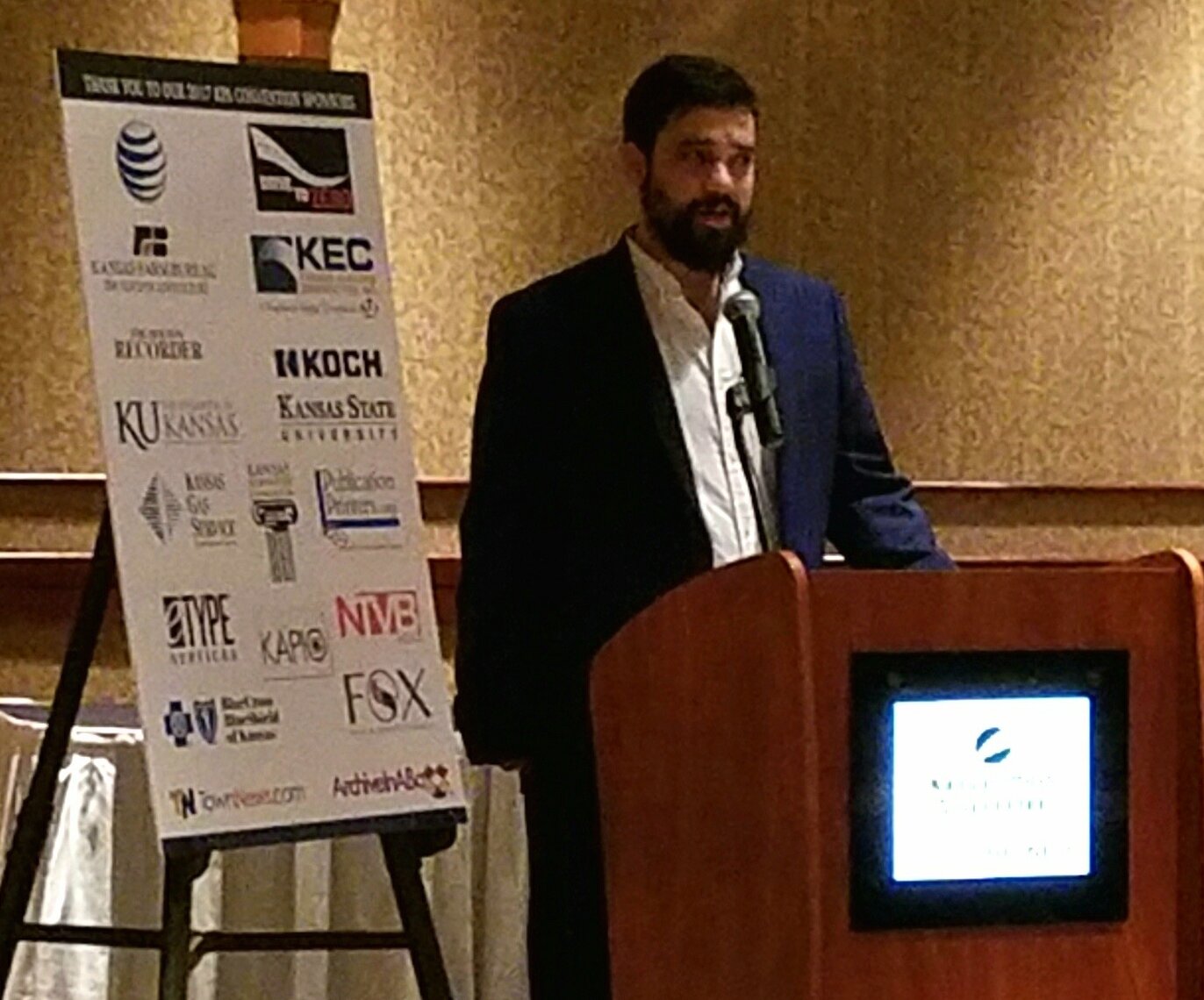 KPV’s managing editor, Adam Strunk, accepts the Victor Murdock Award for investigative journalism. “Our newspaper was the first weekly to win in over a decade,” Majority Owner Joey Young proudly reported to E&P. (Photo by Kansas Publishing Ventures)